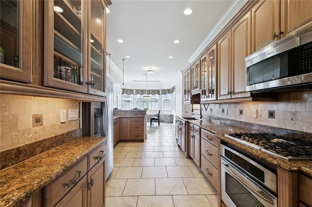 5 Asterbrook Ct, Harvey, LA 70058 - kitchen with appliances with stainless steel finishes, tasteful backsplash, dark stone countertops, recessed lighting, and light tile patterned flooring