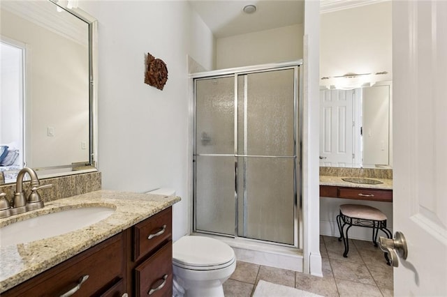 5 Asterbrook Ct, Harvey, LA 70058 - bathroom featuring a shower stall, toilet, vanity, and tile patterned floors