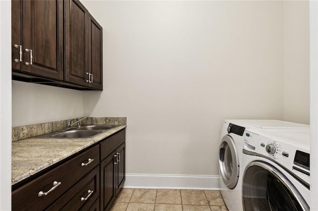 5 Asterbrook Ct, Harvey, LA 70058 - laundry room with separate washer and dryer, baseboards, cabinet space, and light tile patterned floors