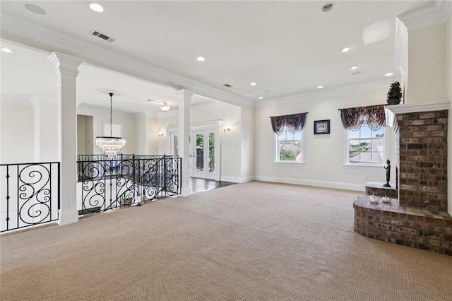 5 Asterbrook Ct, Harvey, LA 70058 - spare room featuring carpet flooring, ornamental molding, decorative columns, a chandelier, and baseboards