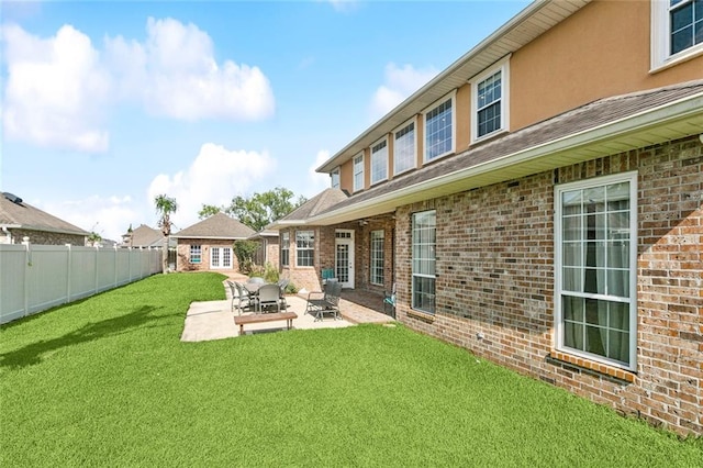 5 Asterbrook Ct, Harvey, LA 70058 - back of house with brick siding and a patio area