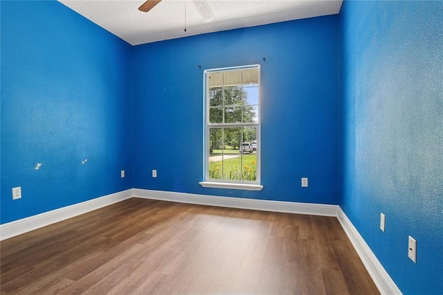 41361 Brown Rd, Ponchatoula, LA 70454 - empty room with wood finished floors, a ceiling fan, baseboards, and a textured ceiling