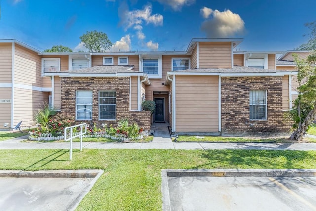 2425 Oxford Pl Unit 139, Gretna, LA 70056 - townhome / multi-family property with a front lawn and brick siding