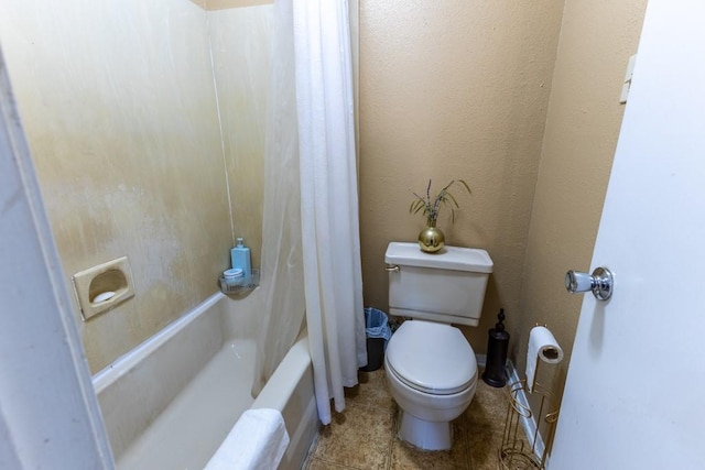 2425 Oxford Pl Unit 139, Gretna, LA 70056 - bathroom featuring toilet, shower / bathtub combination with curtain, and tile patterned flooring