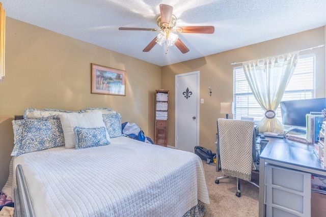 2425 Oxford Pl Unit 139, Gretna, LA 70056 - carpeted bedroom with ceiling fan, a desk, and a textured ceiling