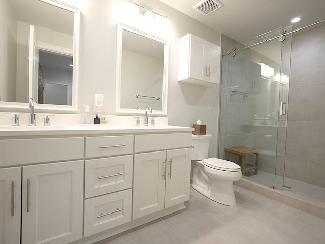 731 St Charles Ave Unit 305, New Orleans, LA 70130 - full bath with double vanity, a shower stall, and toilet