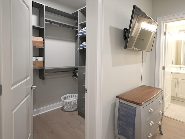 731 St Charles Ave Unit 305, New Orleans, LA 70130 - spacious closet featuring wood finished floors and a sink
