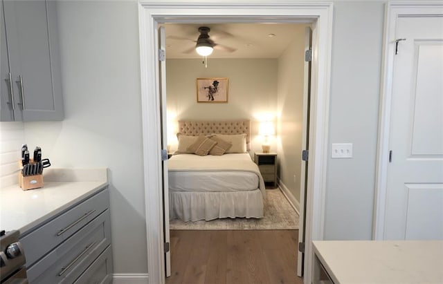 731 St Charles Ave Unit 305, New Orleans, LA 70130 - bedroom with wood finished floors and baseboards