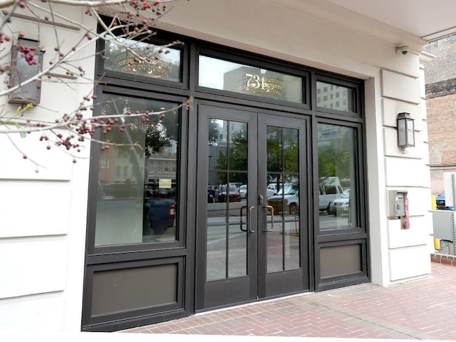 731 St Charles Ave Unit 305, New Orleans, LA 70130 - doorway to property with french doors and a surveillance system