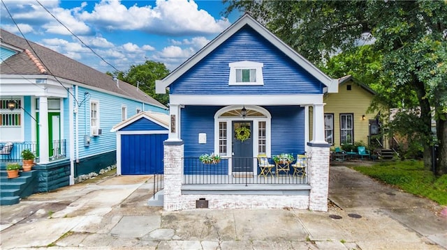 532 Elmira Ave, New Orleans, LA 70114 - shotgun-style home featuring covered porch and an outdoor structure