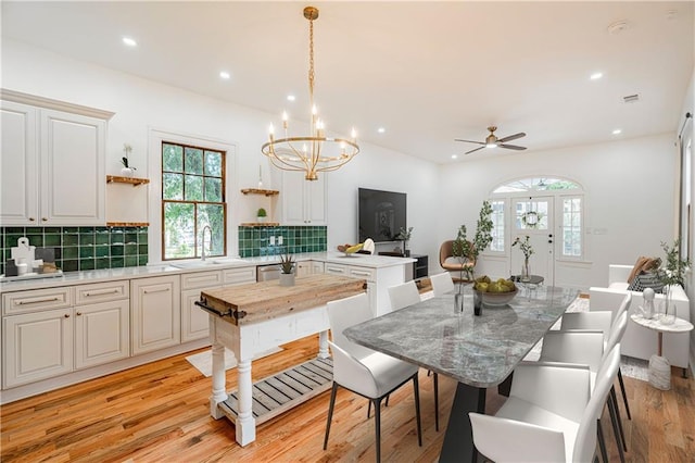532 Elmira Ave, New Orleans, LA 70114 - dining space featuring light wood-style flooring, a chandelier, recessed lighting, and a ceiling fan