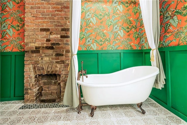532 Elmira Ave, New Orleans, LA 70114 - bathroom featuring a wainscoted wall, wallpapered walls, a freestanding bath, and a decorative wall