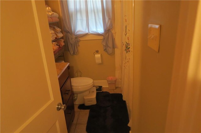 221513 James St, Jefferson, LA 70121 - bathroom featuring vanity, toilet, tile patterned flooring, and a shower with curtain