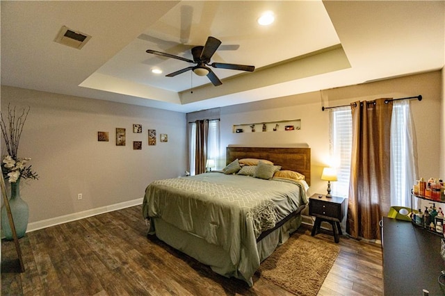 7510 Branch Dr, New Orleans, LA 70128 - bedroom featuring a raised ceiling, wood finished floors, baseboards, a ceiling fan, and recessed lighting