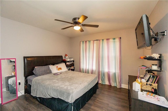 7510 Branch Dr, New Orleans, LA 70128 - bedroom with dark wood-type flooring, baseboards, and a ceiling fan