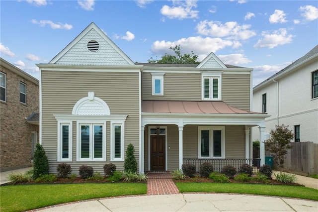 404 Atherton Dr, Metairie, LA 70005 - victorian home with a porch, a standing seam roof, and metal roof