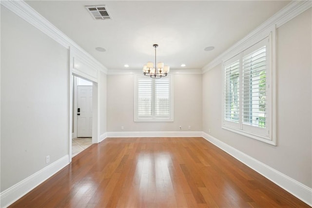 404 Atherton Dr, Metairie, LA 70005 - empty room featuring a chandelier, ornamental molding, wood finished floors, baseboards, and recessed lighting