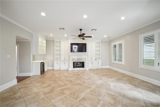 404 Atherton Dr, Metairie, LA 70005 - unfurnished living room featuring ceiling fan, ornamental molding, recessed lighting, beverage cooler, and a fireplace