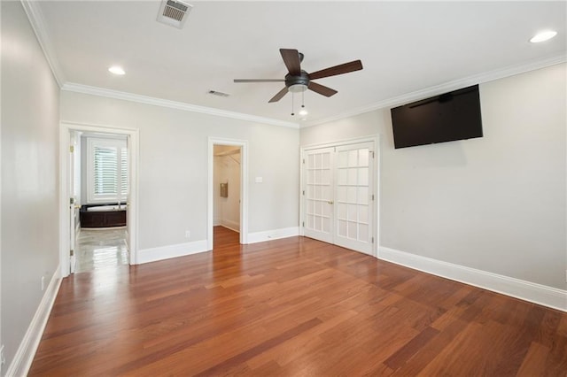 404 Atherton Dr, Metairie, LA 70005 - unfurnished bedroom with wood finished floors, baseboards, a closet, ornamental molding, and recessed lighting