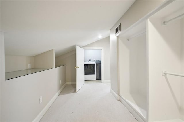 404 Atherton Dr, Metairie, LA 70005 - hallway with washer and clothes dryer, lofted ceiling, light colored carpet, and baseboards