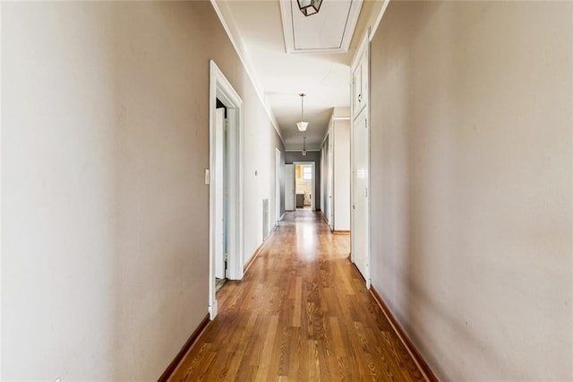 400 Aris Ave, Metairie, LA 70005 - hallway featuring attic access, wood finished floors, baseboards, and ornamental molding
