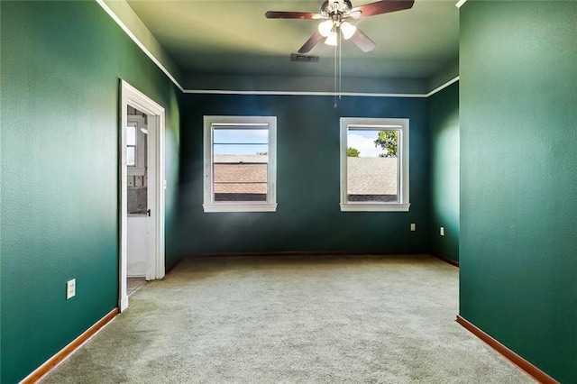 400 Aris Ave, Metairie, LA 70005 - unfurnished room featuring carpet, healthy amount of natural light, a ceiling fan, and baseboards