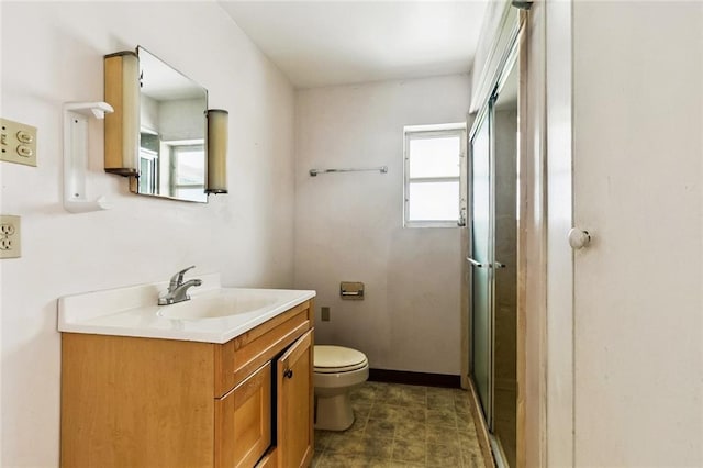 400 Aris Ave, Metairie, LA 70005 - bathroom with vanity, toilet, and a shower with door