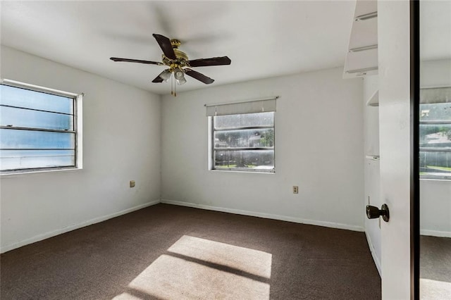 400 Aris Ave, Metairie, LA 70005 - carpeted empty room featuring plenty of natural light, a ceiling fan, and baseboards