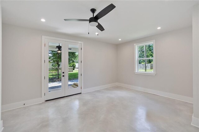 218 N Jackson Ave, Covington, LA 70433 - spare room with ceiling fan, concrete flooring, french doors, recessed lighting, and baseboards