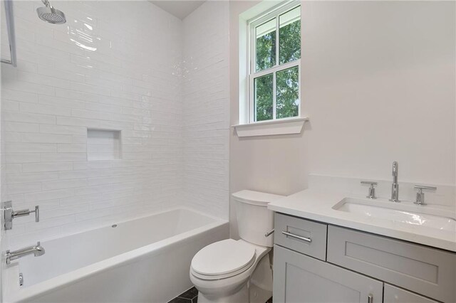 218 N Jackson Ave, Covington, LA 70433 - full bath with toilet, vanity, and shower / tub combination