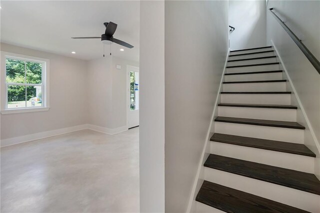 218 N Jackson Ave, Covington, LA 70433 - stairway with healthy amount of natural light, ceiling fan, baseboards, recessed lighting, and concrete flooring