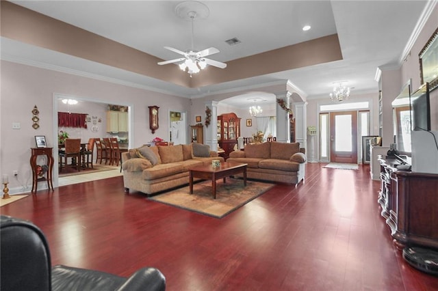 135 Maud Olive Dr, Belle Chasse, LA 70037 - living area with ornate columns, a chandelier, dark wood-style floors, crown molding, and a ceiling fan