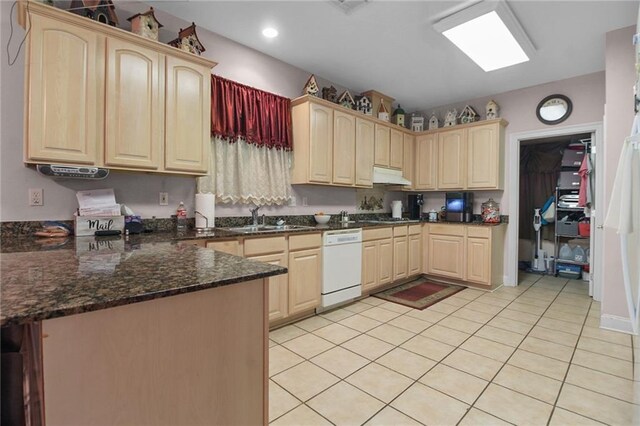 135 Maud Olive Dr, Belle Chasse, LA 70037 - kitchen featuring white dishwasher, under cabinet range hood, light brown cabinets, light tile patterned floors, and recessed lighting
