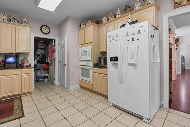 135 Maud Olive Dr, Belle Chasse, LA 70037 - kitchen featuring white appliances, light brown cabinets, and light tile patterned floors