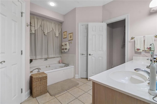 135 Maud Olive Dr, Belle Chasse, LA 70037 - full bathroom with a tub with jets, double vanity, and tile patterned floors