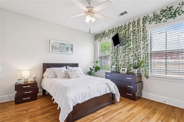 436 Northpark Blvd, Covington, LA 70433 - bedroom with baseboards, light wood finished floors, and ceiling fan