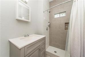 2543-45 Gravier St, New Orleans, LA 70119 - bathroom with vanity and tiled shower