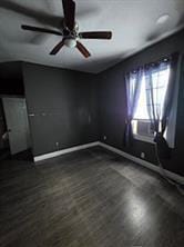 2543-45 Gravier St, New Orleans, LA 70119 - spare room with ceiling fan, baseboards, and dark wood-type flooring