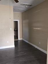 2543-45 Gravier St, New Orleans, LA 70119 - unfurnished room with baseboards, ceiling fan, and dark wood finished floors