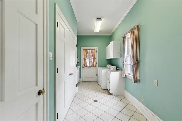 9816 Elm Pl, River Ridge, LA 70123 - laundry area featuring washing machine and dryer, cabinet space, ornamental molding, baseboards, and light tile patterned floors