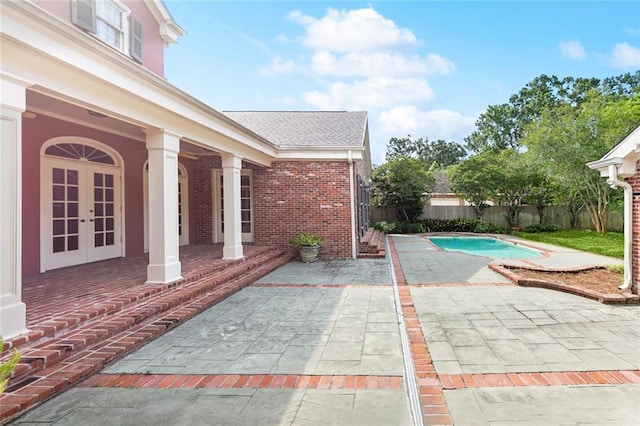 9816 Elm Pl, River Ridge, LA 70123 - fenced backyard with a patio area and french doors