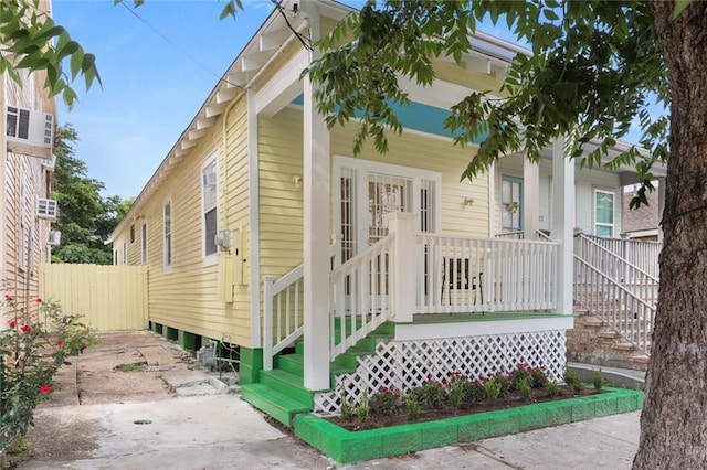 2718 Palmyra St, New Orleans, LA 70119 - view of front of home with a porch