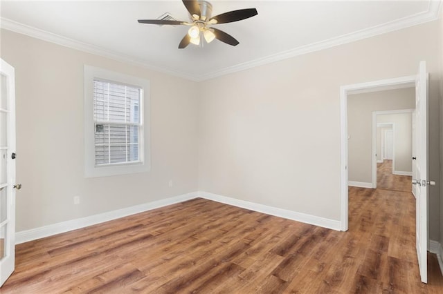 2718 Palmyra St, New Orleans, LA 70119 - unfurnished room with ornamental molding, baseboards, wood finished floors, and ceiling fan