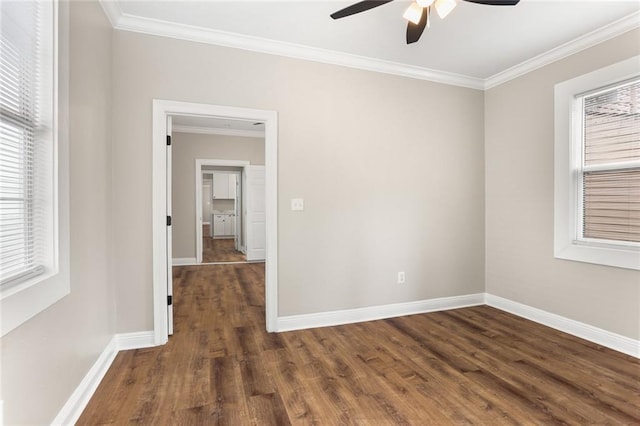 2718 Palmyra St, New Orleans, LA 70119 - empty room with ceiling fan, wood finished floors, ornamental molding, and baseboards