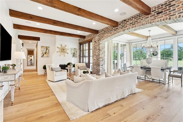 28 Wax Myrtle Ln, Covington, LA 70433 - living area with beamed ceiling, a chandelier, light wood-type flooring, baseboards, and recessed lighting