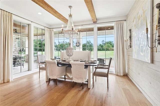 28 Wax Myrtle Ln, Covington, LA 70433 - dining room with plenty of natural light, beam ceiling, light wood finished floors, and a chandelier