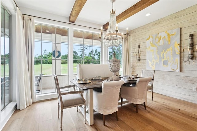 28 Wax Myrtle Ln, Covington, LA 70433 - dining area with wood walls, healthy amount of natural light, a chandelier, wood finished floors, and beam ceiling
