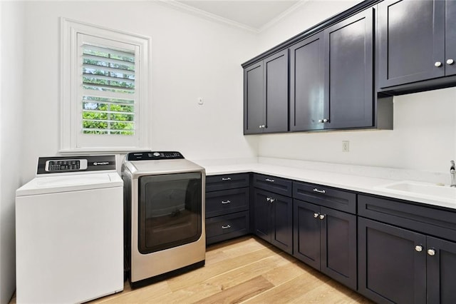 28 Wax Myrtle Ln, Covington, LA 70433 - laundry room featuring cabinet space, separate washer and dryer, crown molding, and light wood-style floors
