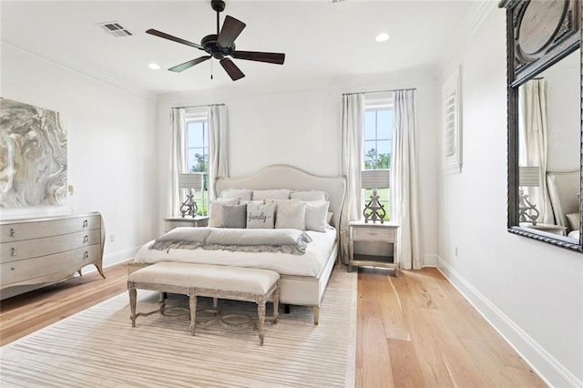 28 Wax Myrtle Ln, Covington, LA 70433 - bedroom with multiple windows, light wood-style flooring, baseboards, crown molding, and recessed lighting