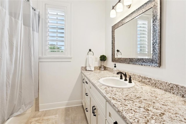28 Wax Myrtle Ln, Covington, LA 70433 - bathroom with vanity, baseboards, and shower / bath combo